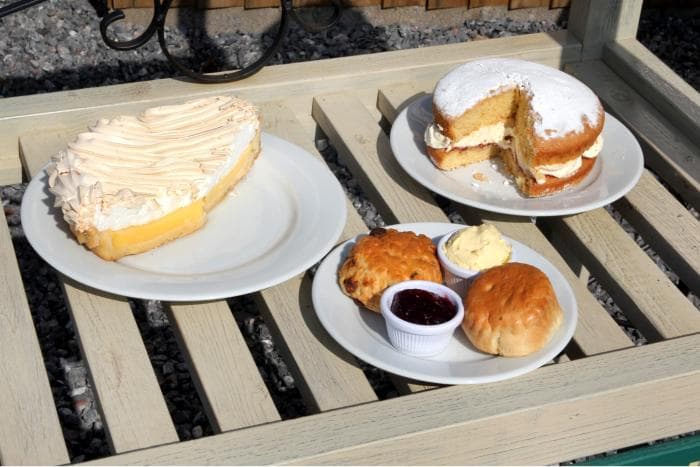 Homemade lemon meringue, Victoria sponge and a Devon cream tea in the sunshine at Caroline's Kitchen