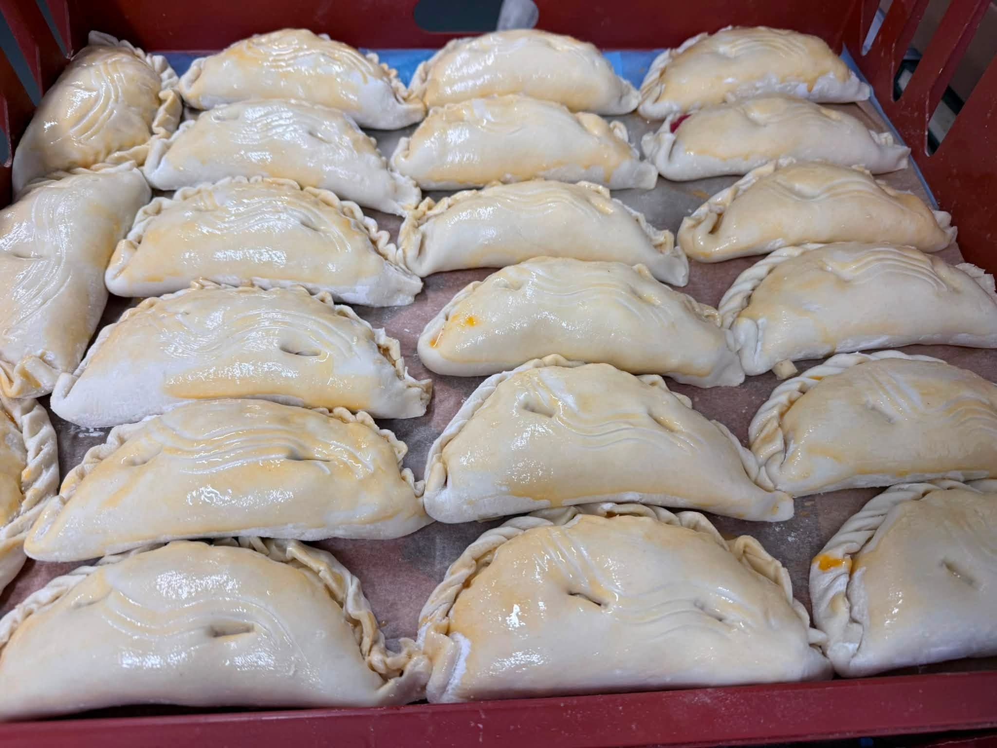 A tray of hand-crimped Churston pasties, glazed and ready for the oven